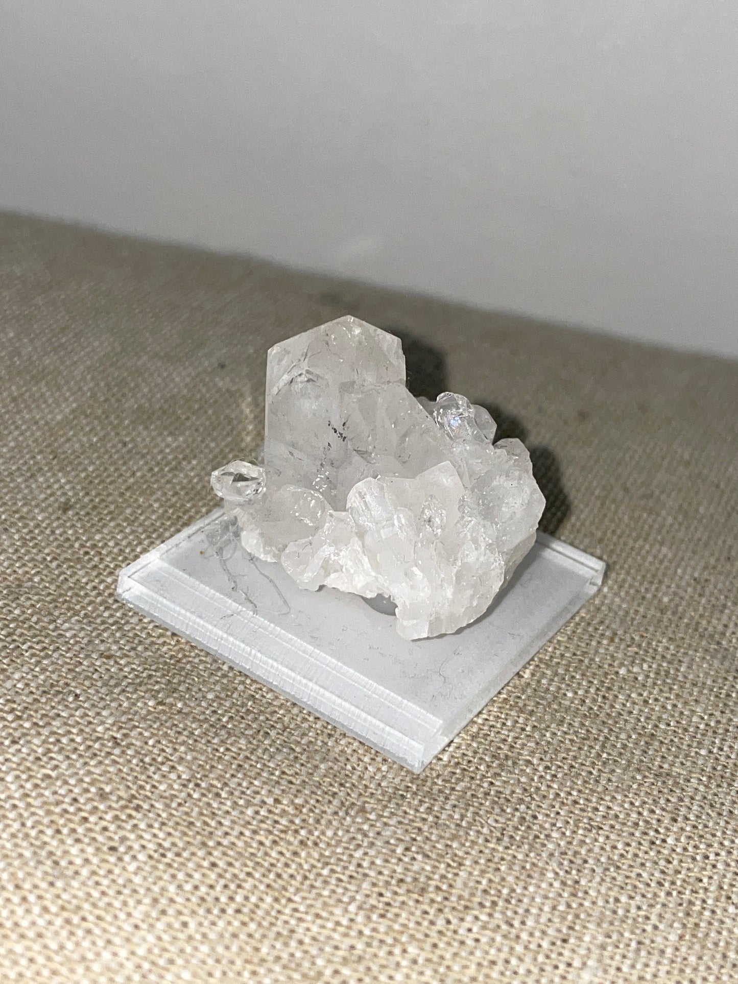 Clear quartz point cluster mounted