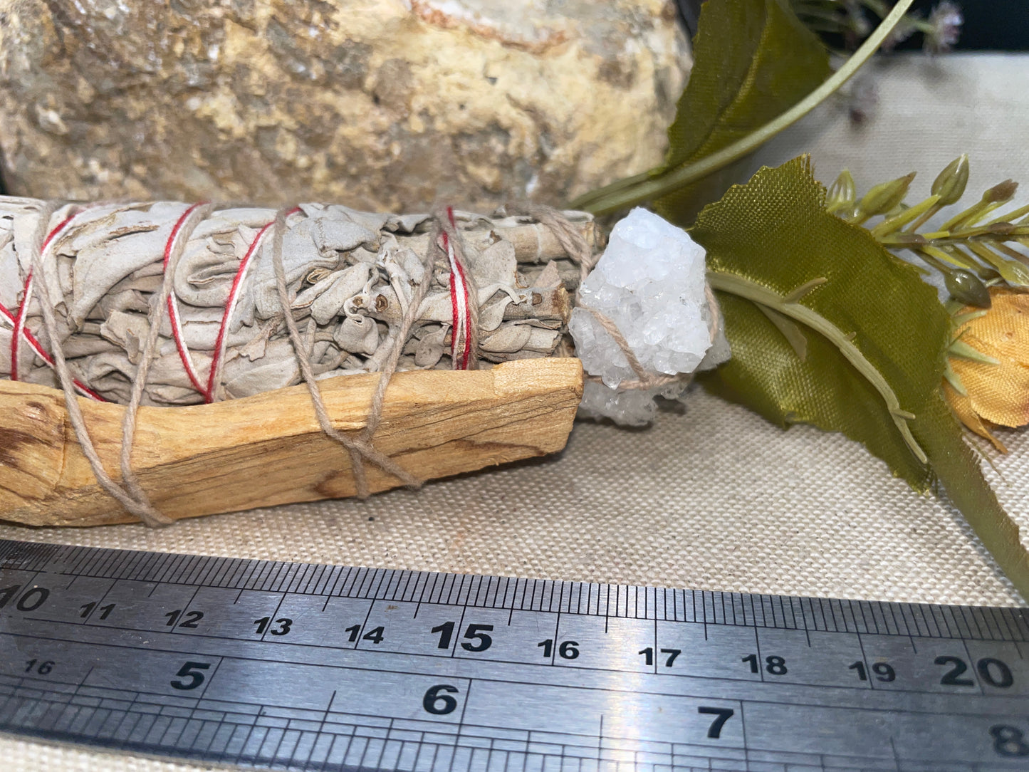 White sage and palo santo smudge wand with quartz cluster