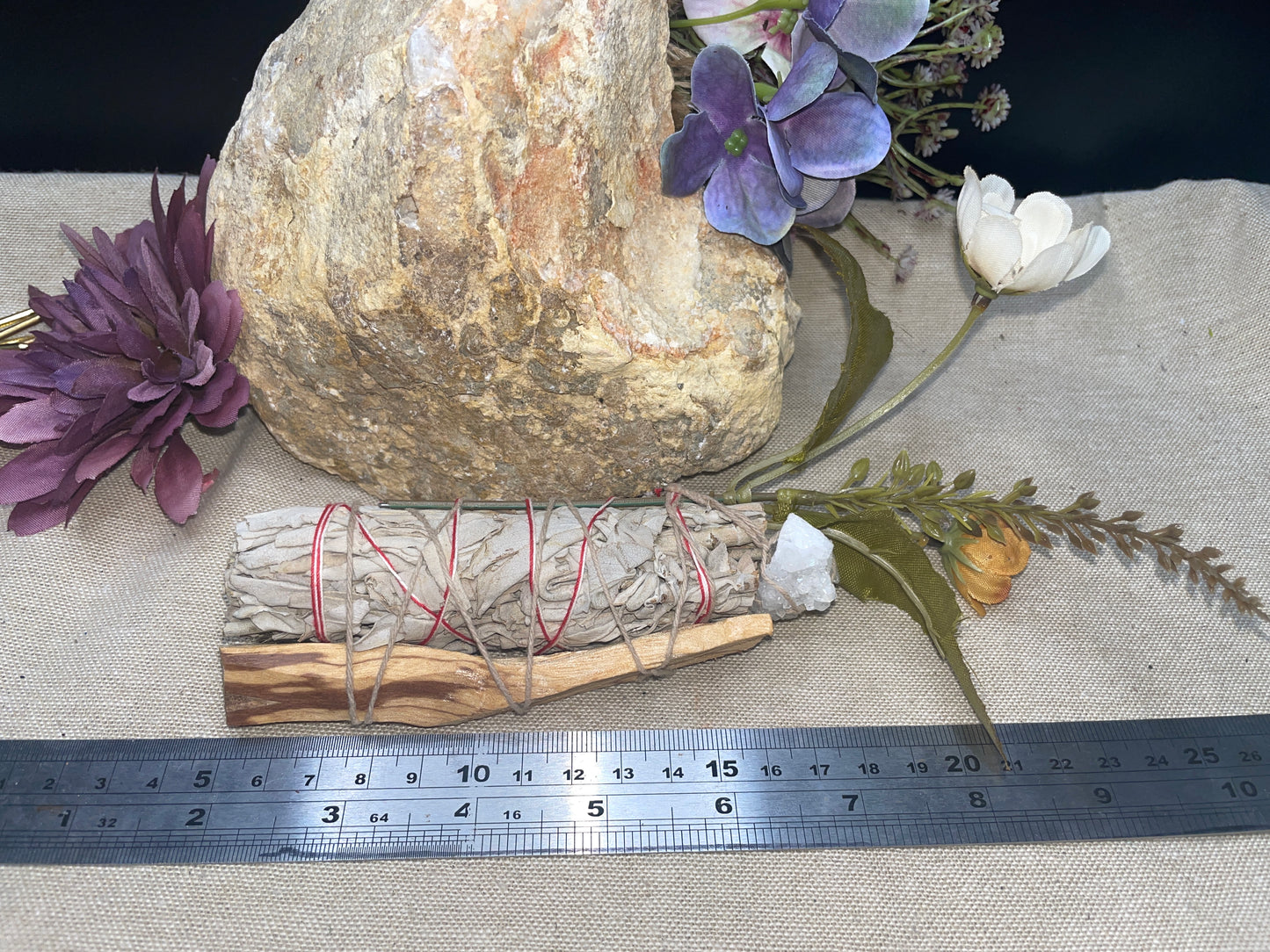White sage and palo santo smudge wand with quartz cluster