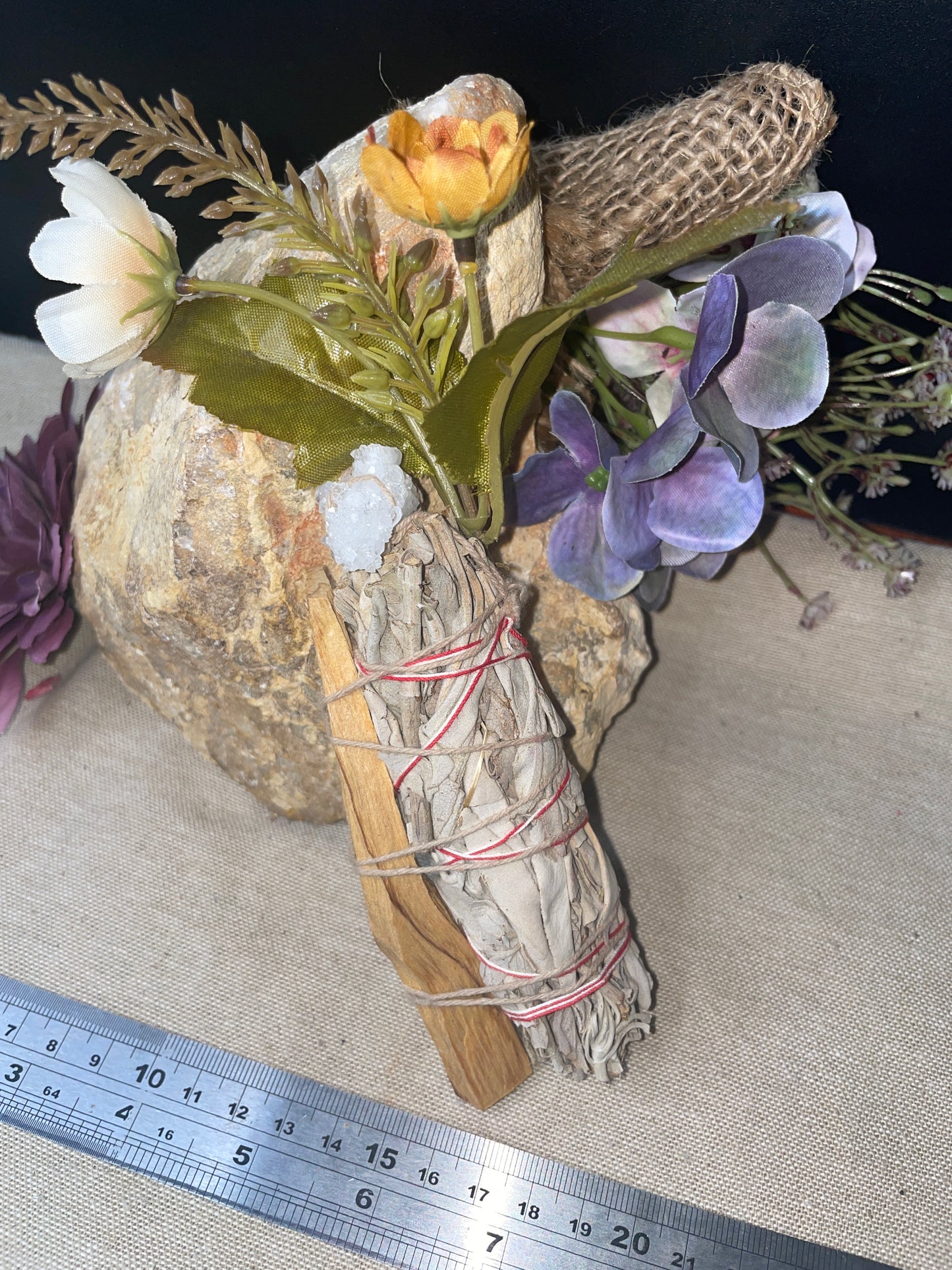 White sage and palo santo smudge wand with quartz cluster