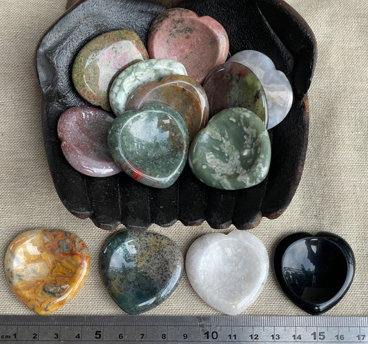 Heart carved assorted stone. Thumb stone