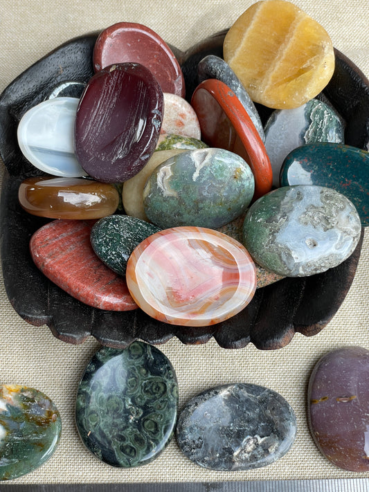 Oval carved stone. Thumb stone
