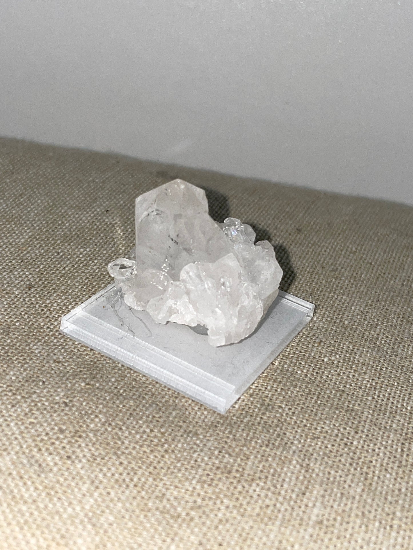 Clear quartz point cluster mounted