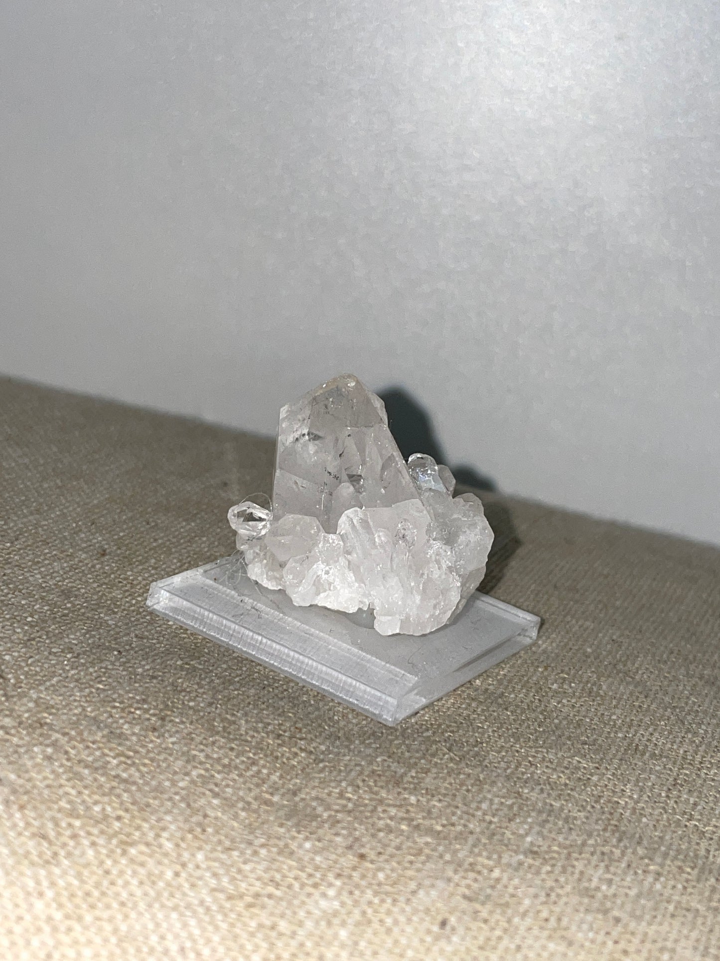 Clear quartz point cluster mounted
