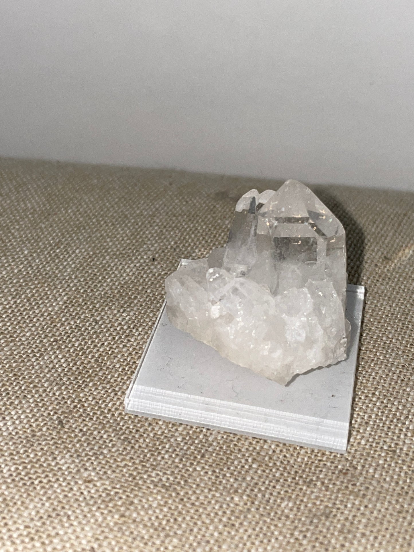 Clear quartz point cluster mounted