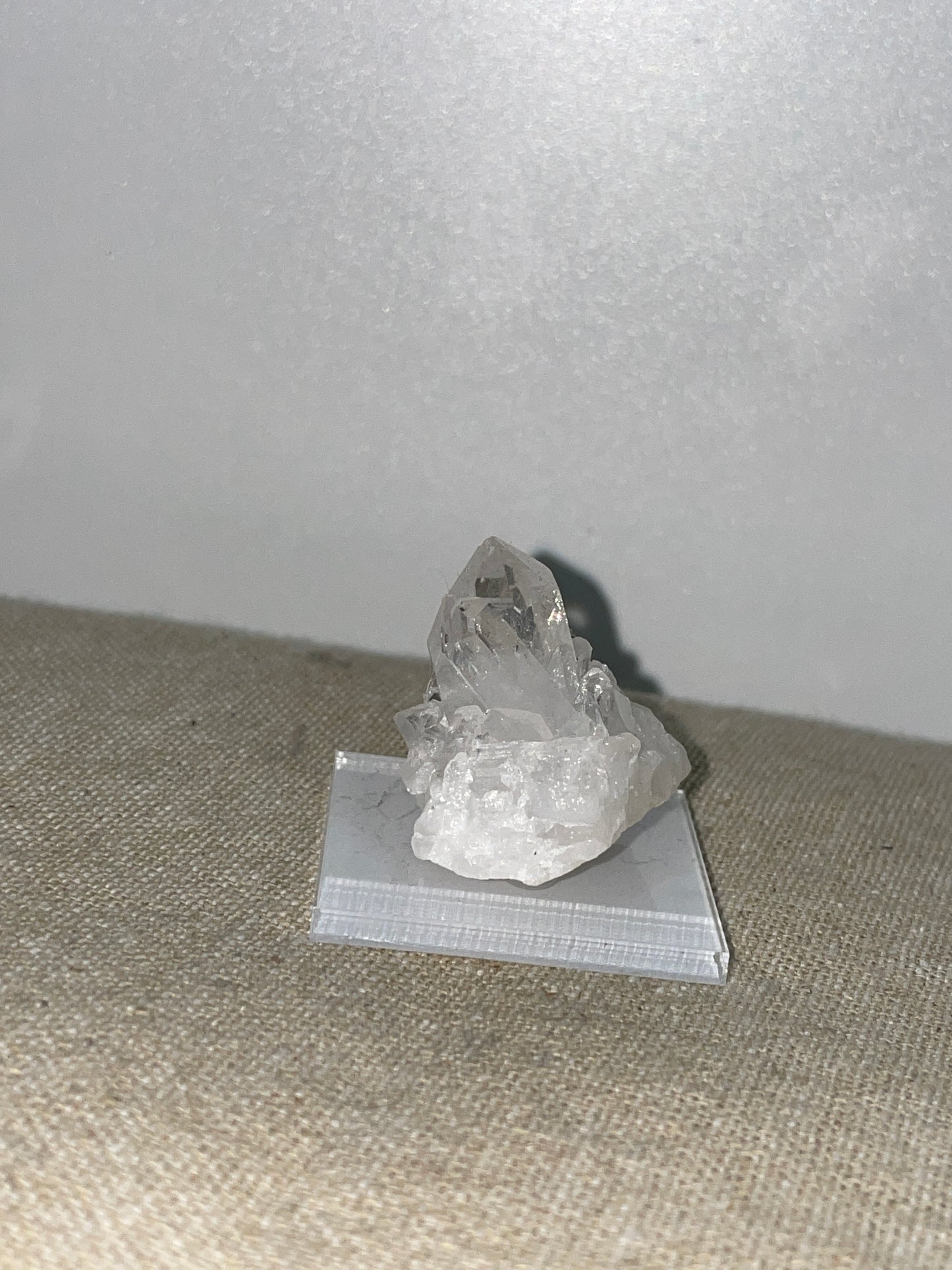 Clear quartz point cluster mounted