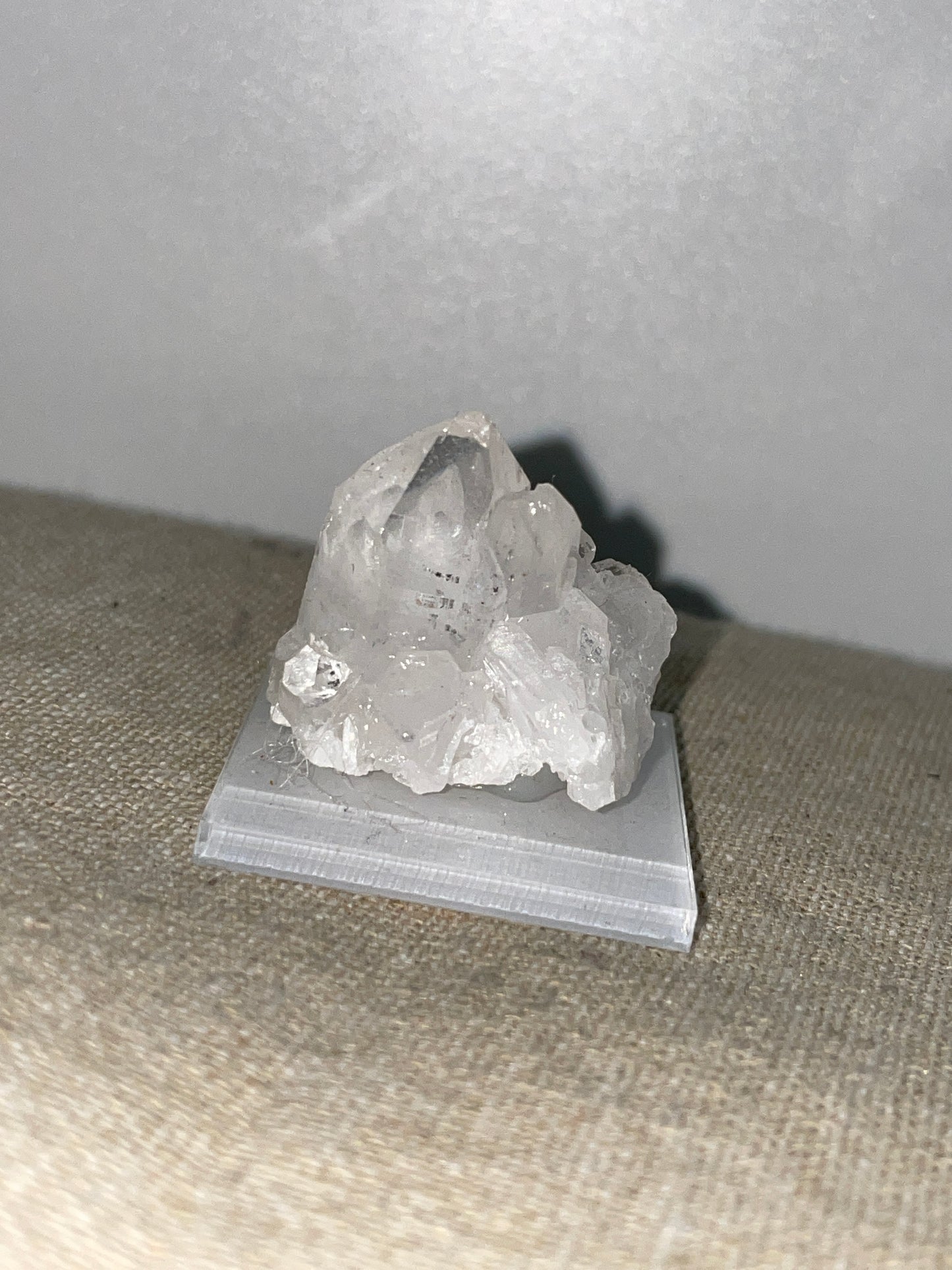 Clear quartz point cluster mounted
