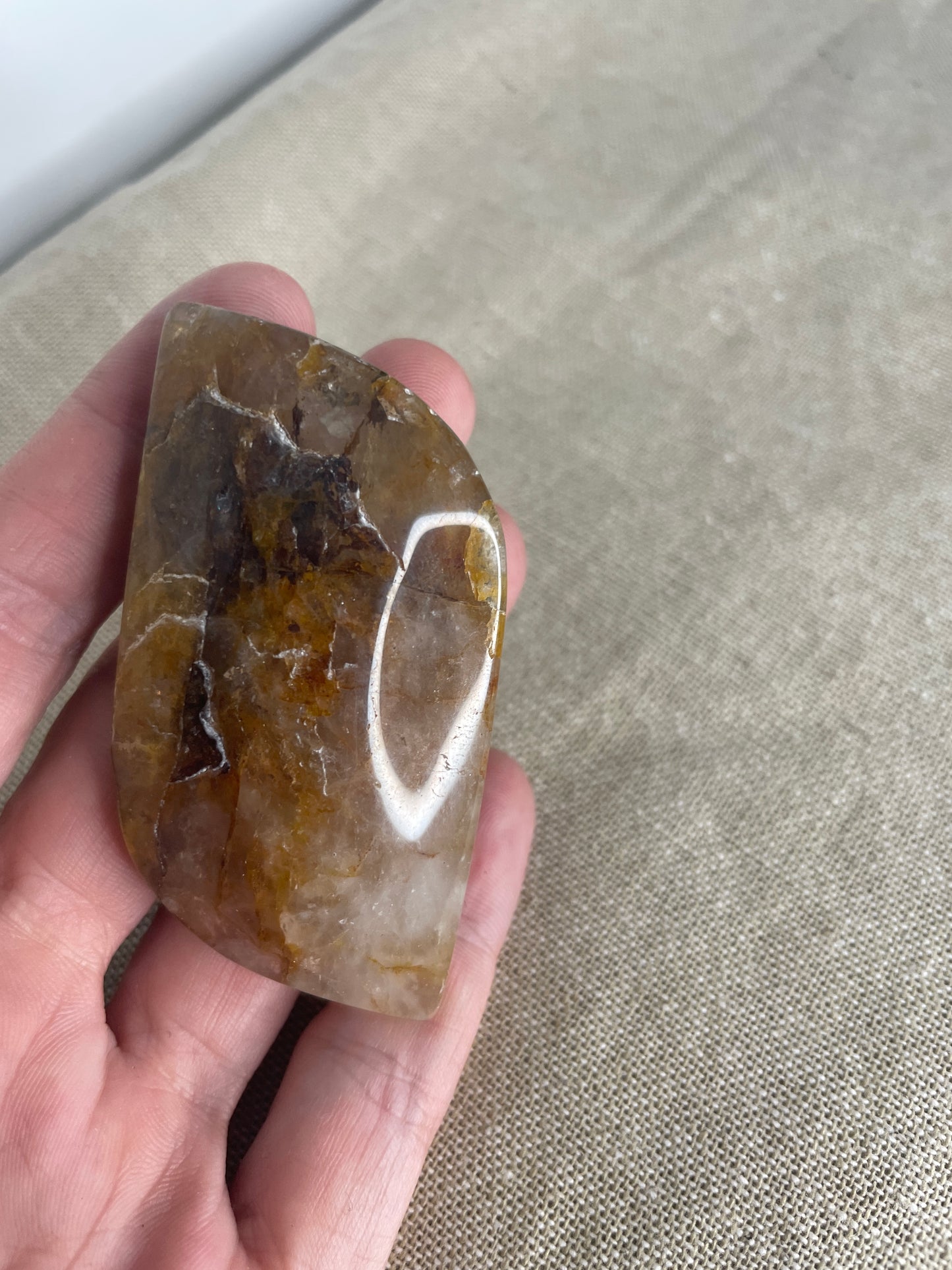Golden healer leaf palm stone