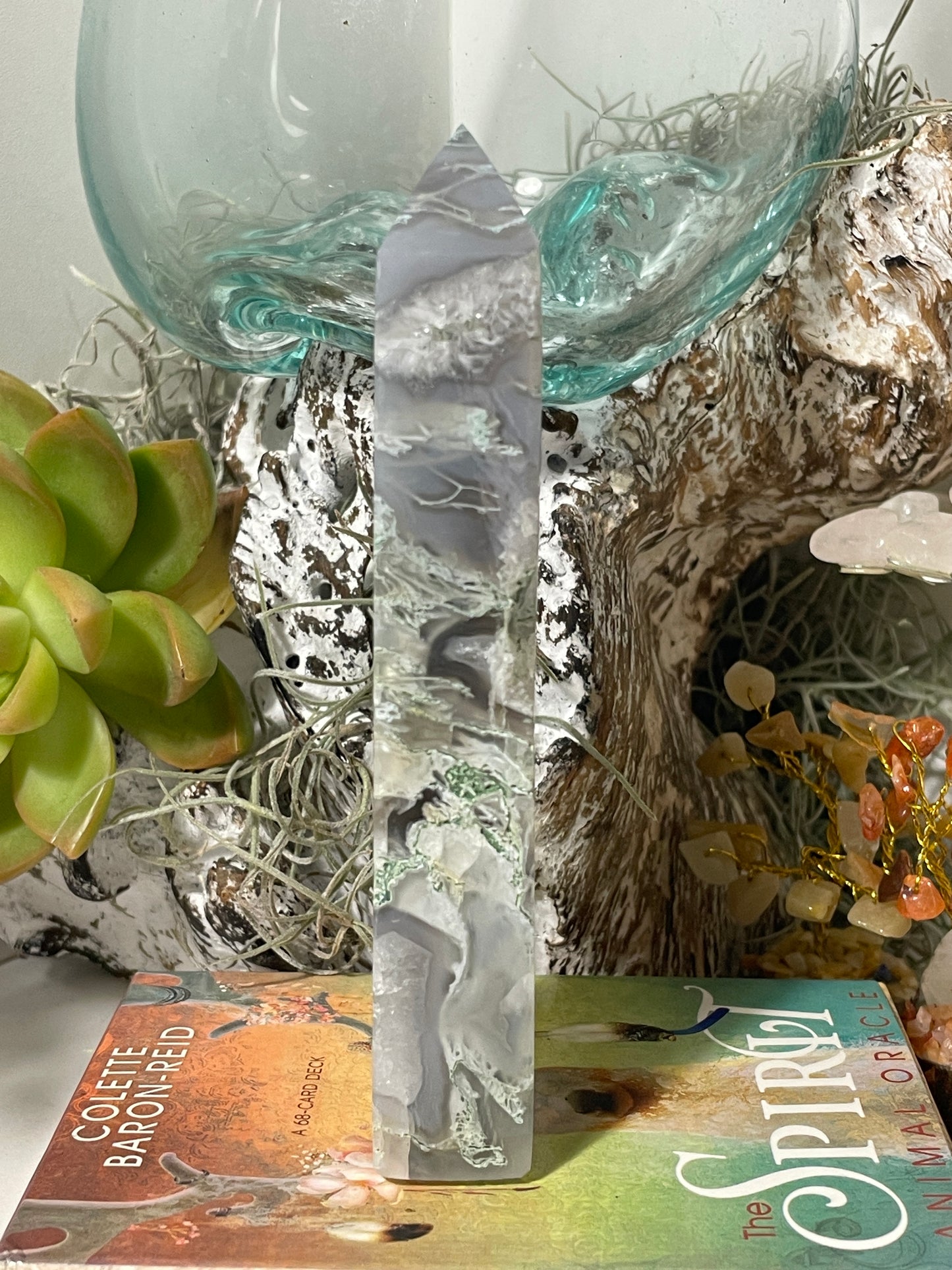 Moss agate tower with vugs