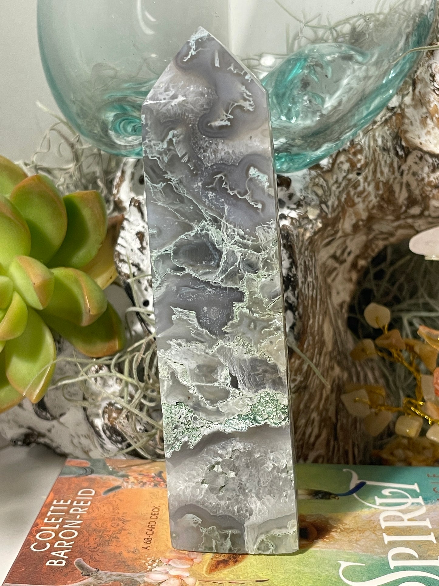 Moss agate tower with vugs